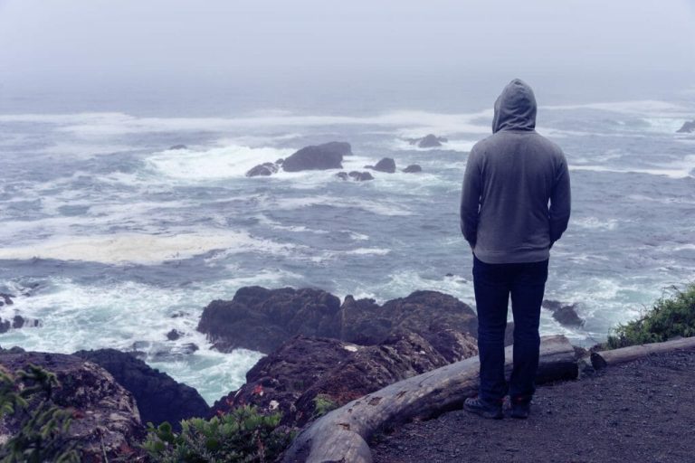 10 Prayers for Strength in Hard Times person looking at stormy sea