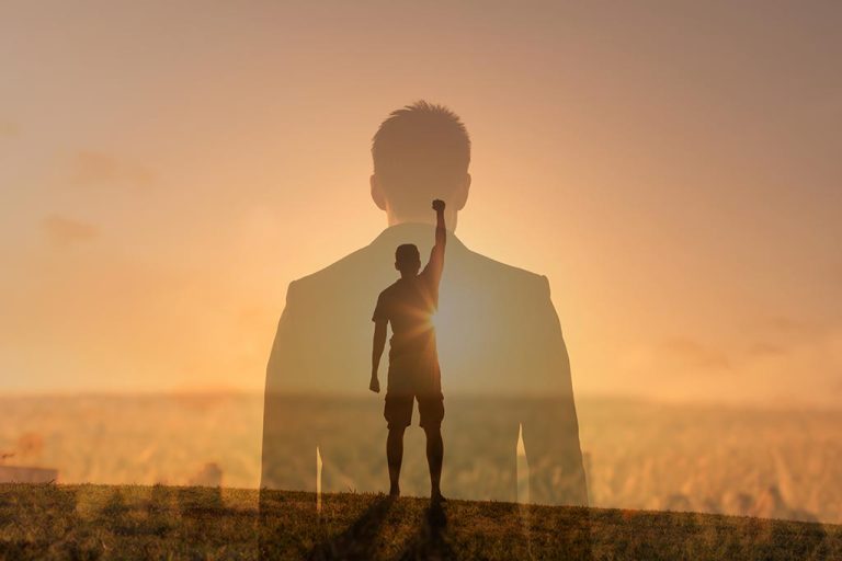Your Daily Dose: 150 Powerful Motivational Quotes for Success person looking at a sunrise